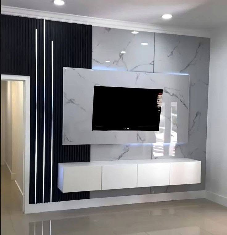 Marble media wall with fluted black accent panelling