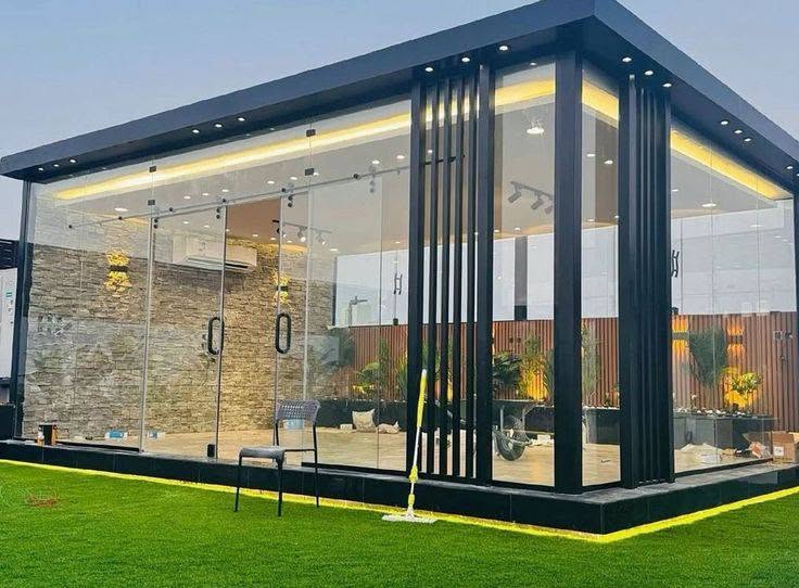 Glass garden room outdoor lounge with stone accent wall