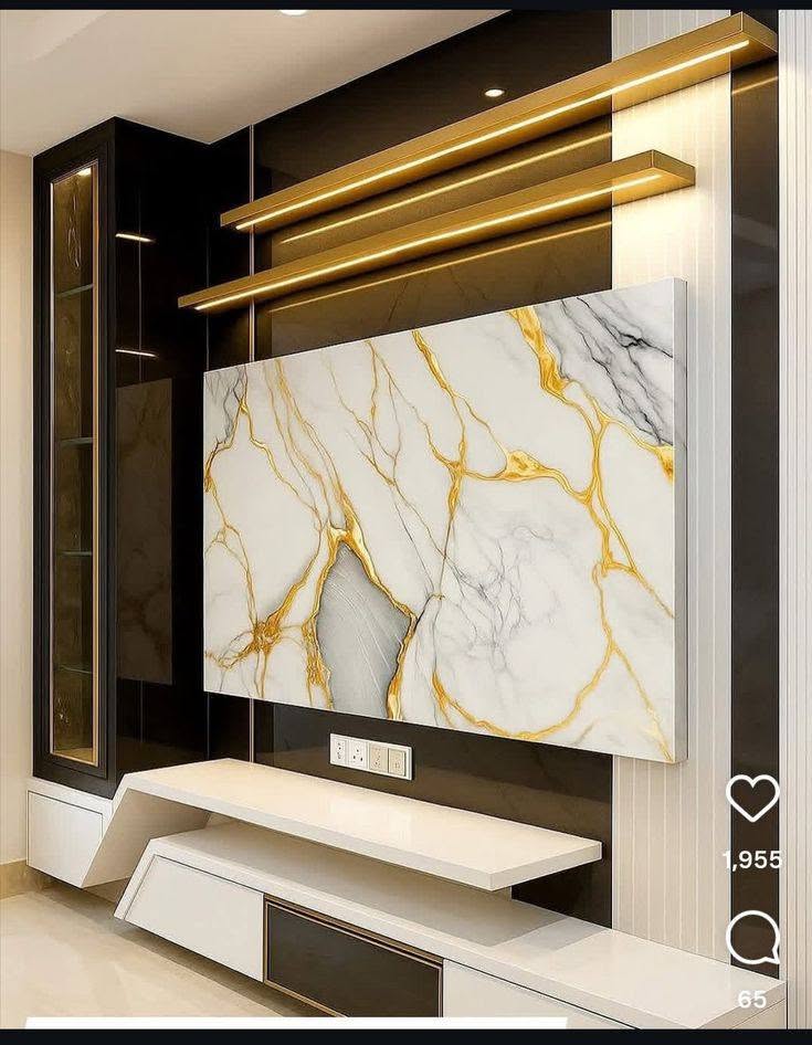 Gold-veined marble TV wall with brass light coves