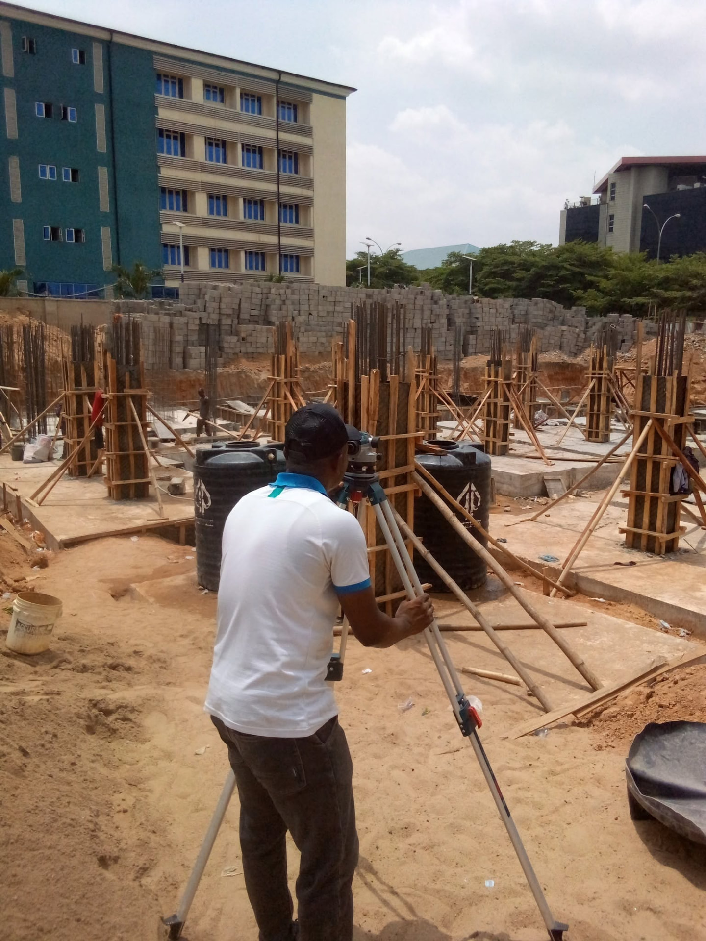 Surveyor working on an active Amocity building site